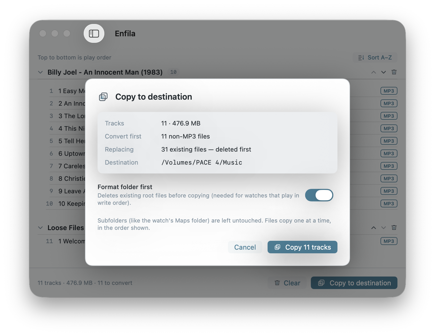Enfila's copy confirmation showing track count, what's replaced, and the destination.